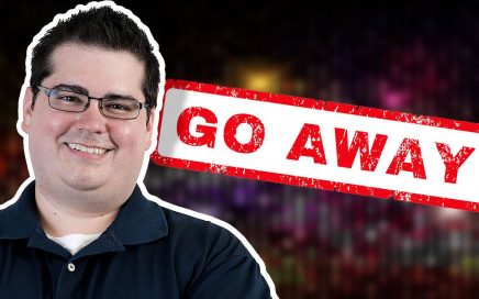 picture of Justin in front of a sign that says go away